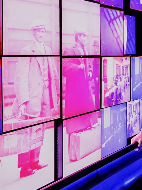 Tourists viewing historical images at One World Observatory, New York City.