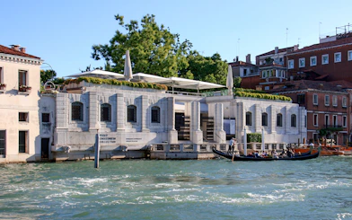 Gondola ride past Peggy Guggenheim Collection in Venice, Italy.