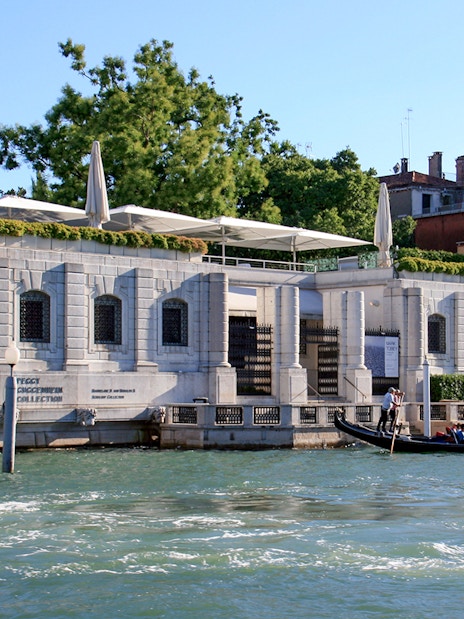 Gondola ride past Peggy Guggenheim Collection in Venice, Italy.