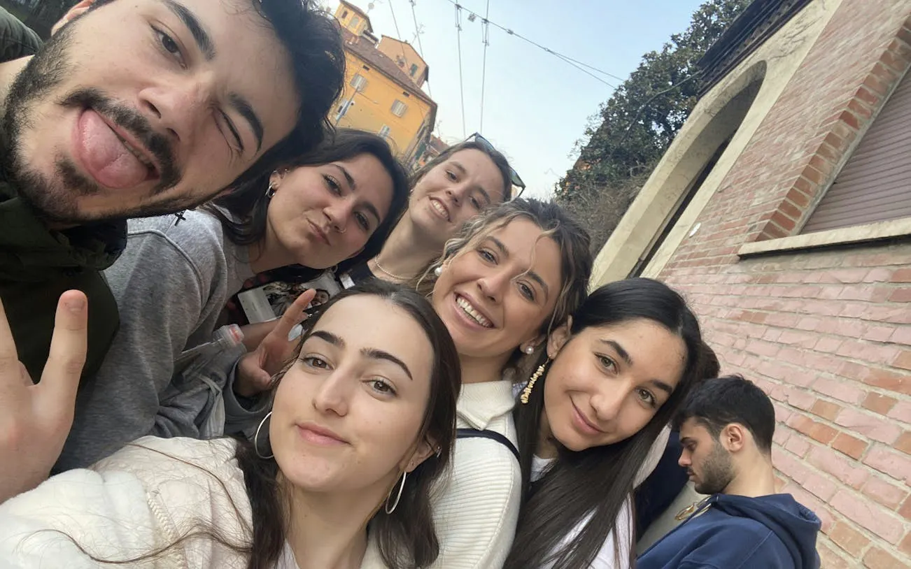 Group of friends enjoying a self-guided city exploration in Bologna.