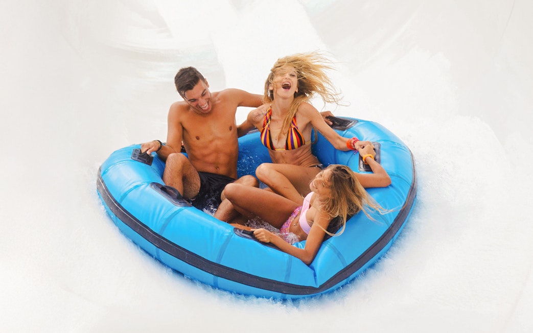 Visitors enjoying a raft ride at Aquafan Water Park.