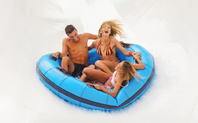 Visitors enjoying a raft ride at Aquafan Water Park.