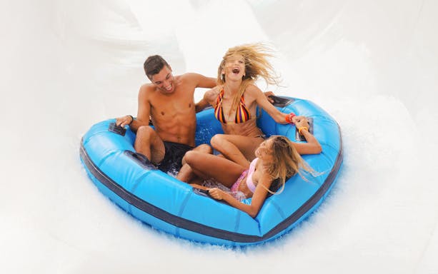 Visitors enjoying a raft ride at Aquafan Water Park.