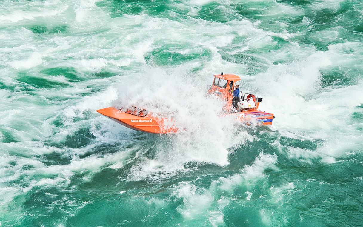 Whirlpool Jet Boat navigating rapids in Niagara Gorge, Canada.