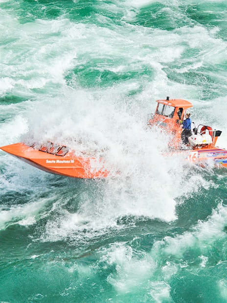 Whirlpool Jet Boat navigating rapids in Niagara Gorge, Canada.