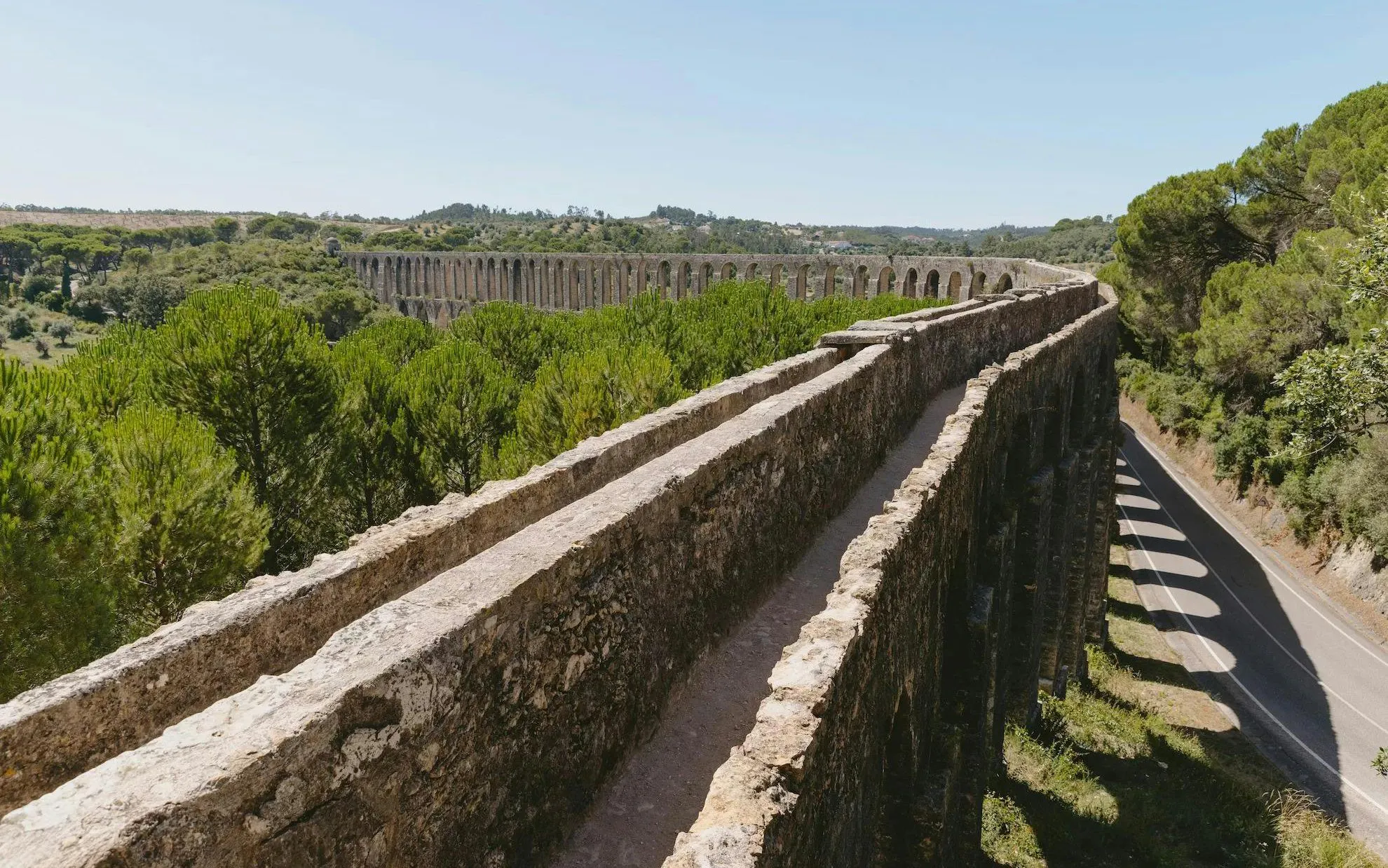 Aqueduto dos Pegões spanning a lush landscape in Tomar, Portugal.