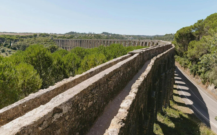 Aqueduto dos Pegões spanning a lush landscape in Tomar, Portugal.