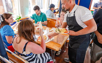 Guests dining onboard Elaphite Island Cruise, Dubrovnik.