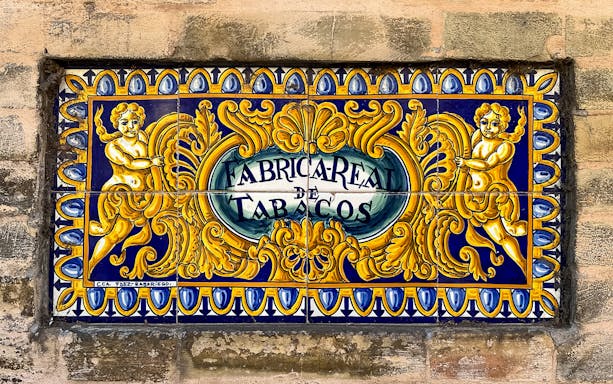 Ceramic tile sign of Fábrica Real de Tabacos in Seville.