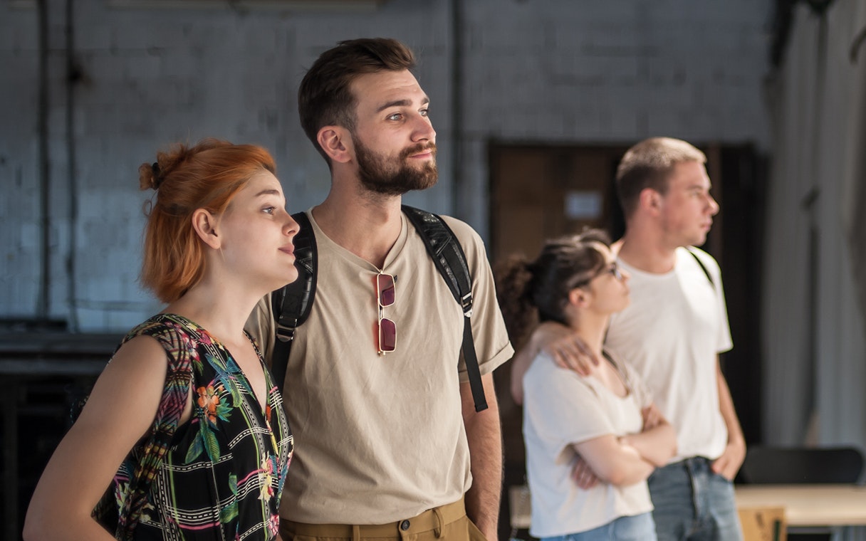 Visitors observing exhibits inside a museum.