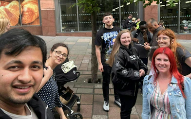 Group of people participating in Glasgow Murder Mystery city exploration game.
