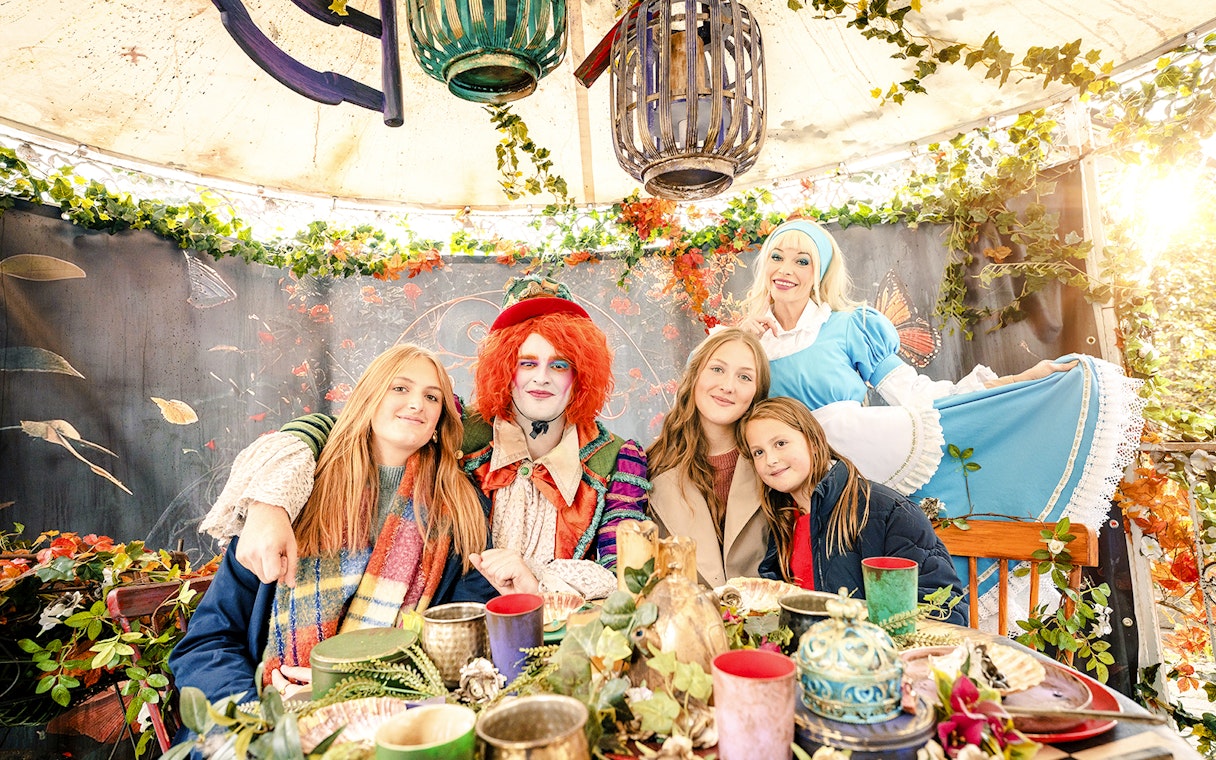 Group enjoying Halloween tea party with costumed characters at Bobbejaanland.