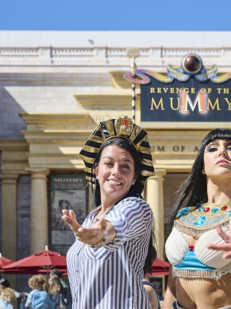 Visitors in Egyptian costumes at Revenge of the Mummy attraction, Universal Studios Orlando.