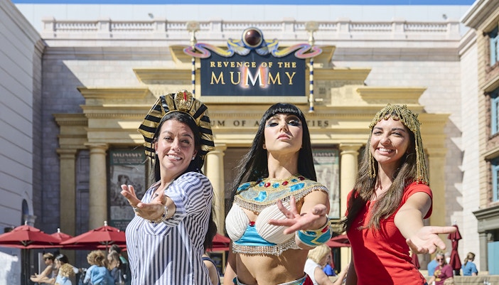 Visitors in Egyptian costumes at Revenge of the Mummy attraction, Universal Studios Orlando.