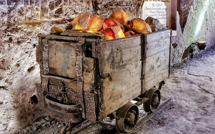Mining cart filled with salt rocks inside Berchtesgaden Salt Mine.