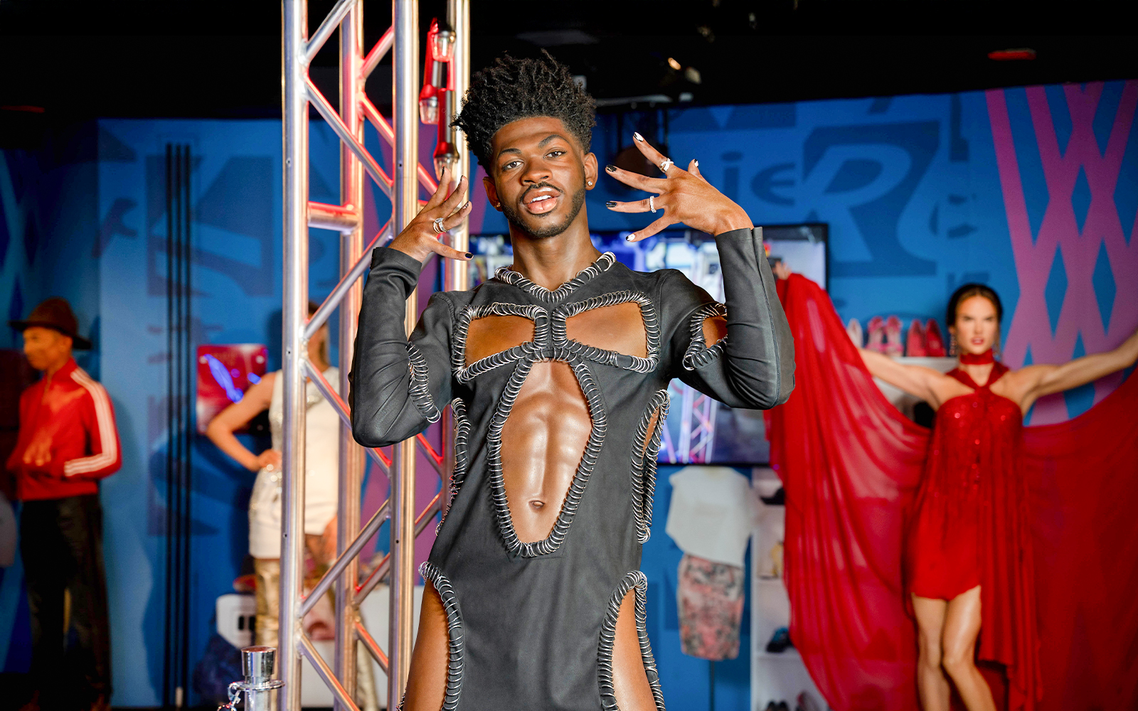 Wax figure of Lil Nas X at Madame Tussauds, New York, in a unique outfit.