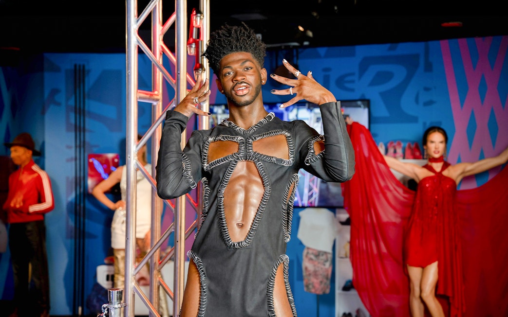 Wax figure of Lil Nas X at Madame Tussauds, New York, in a unique outfit.