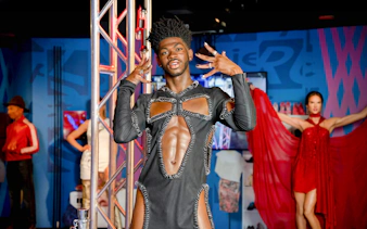 Wax figure of Lil Nas X at Madame Tussauds, New York, in a unique outfit.