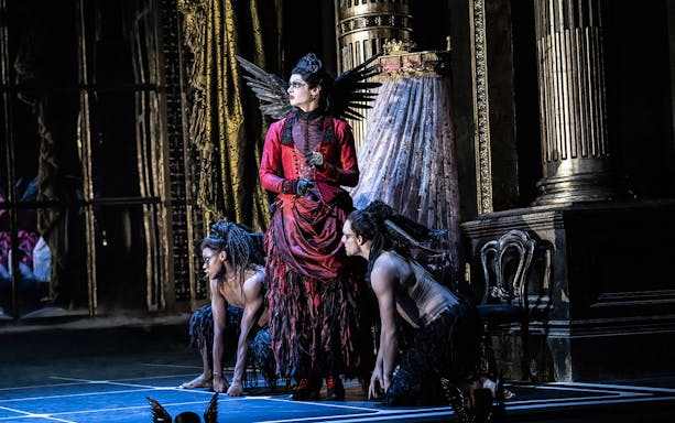 Performer in elaborate costume on stage during Matthew Bourne's Sleeping Beauty.