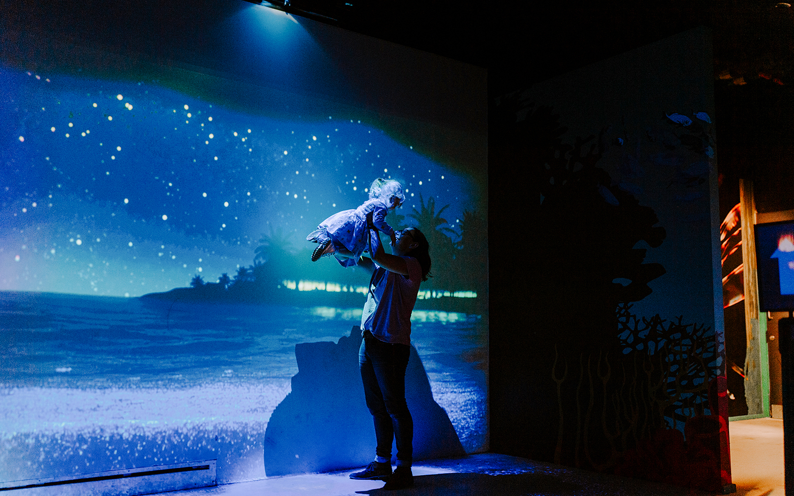 Guests enjoying interactive ocean display at SEA Life Brighton.