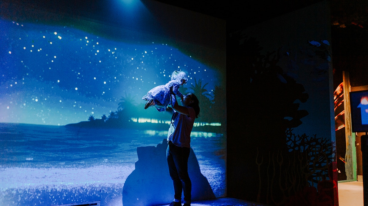 Guests enjoying interactive ocean display at SEA Life Brighton.