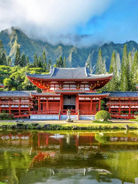 Byodo-In Temple with mountains and greenery in the Valley of the Temples, Oahu, Hawaii.