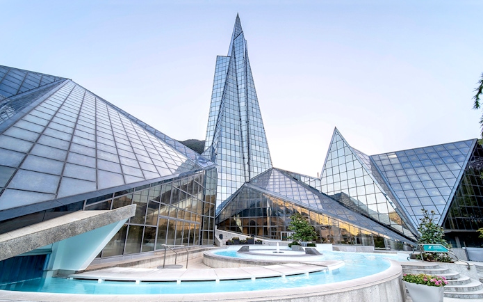 Caldea spa exterior with mountain backdrop in Andorra, highlighting Caldea Classic Entry Tickets.