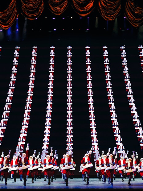 Radio City Rockettes performing in Christmas Spectacular with synchronized dance routine.