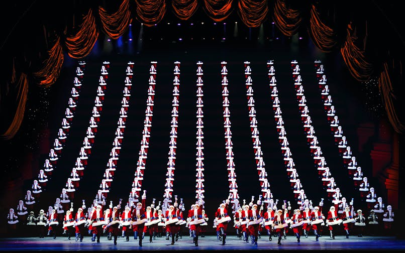 Radio City Rockettes performing in Christmas Spectacular with synchronized dance routine.