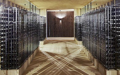 Wine cellar with rows of bottles at Cockburn's English tour and Super Premium tasting.