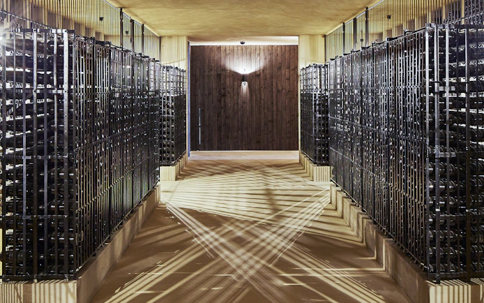 Wine cellar with rows of bottles at Cockburn's English tour and Super Premium tasting.