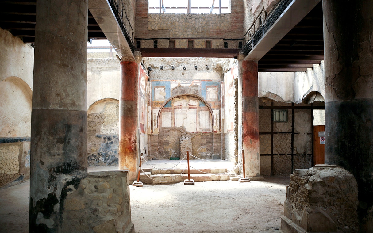 Herculaneum ruins with ancient frescoes and columns, Italy.
