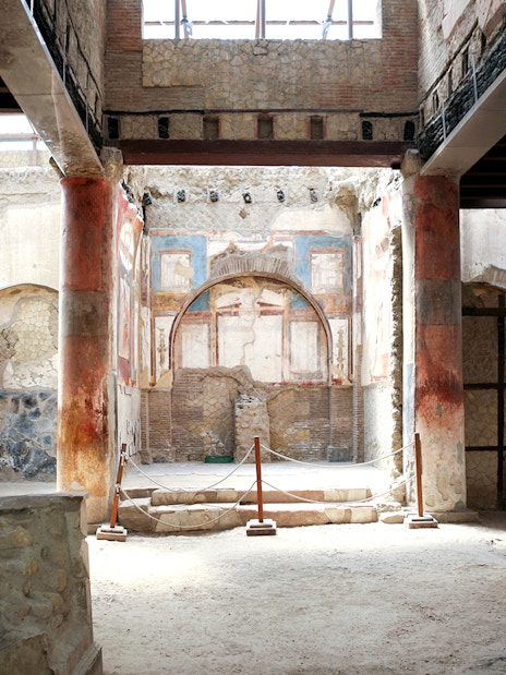 Herculaneum ruins with ancient frescoes and columns, Italy.
