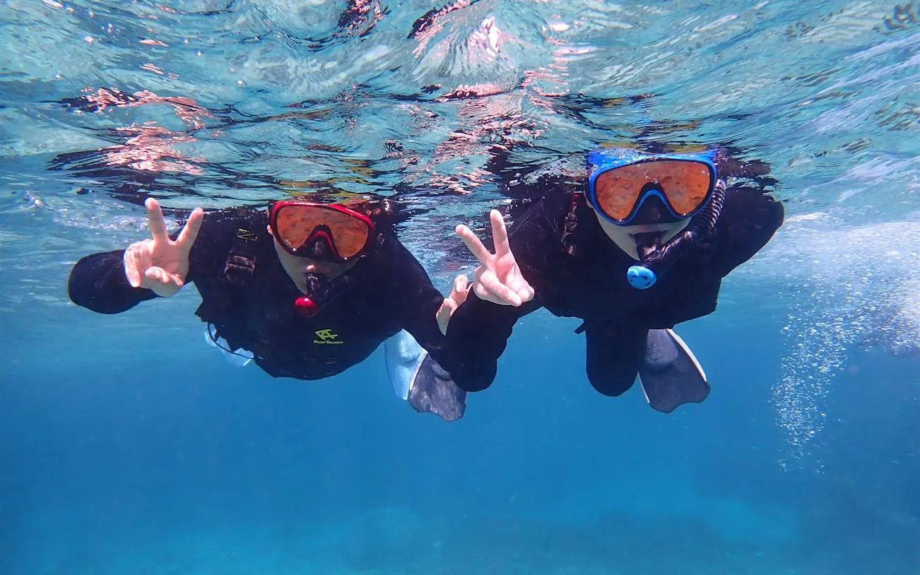 Snorkelers underwater at Phantom Island, Ishigaki, Okinawa.