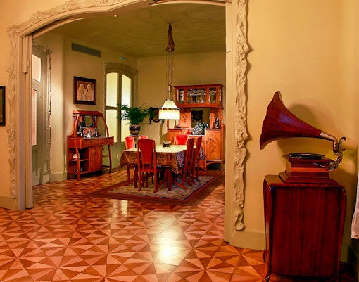 Casa Mila fourth-floor apartment interior with period furnishings in Barcelona, Spain.