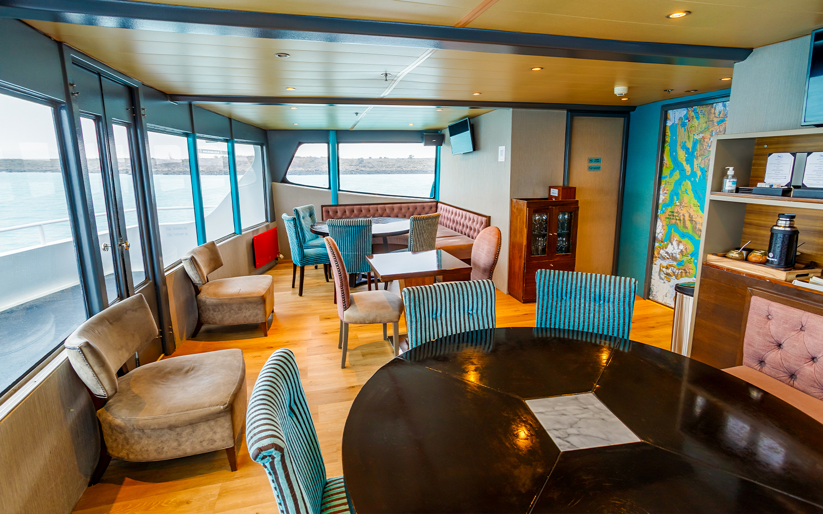 Premium boat interior with seating and lake view during Perito Moreno, Spegazzini & Upsala tour.