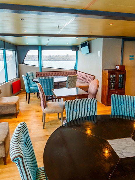 Premium boat interior with seating and lake view during Perito Moreno, Spegazzini & Upsala tour.