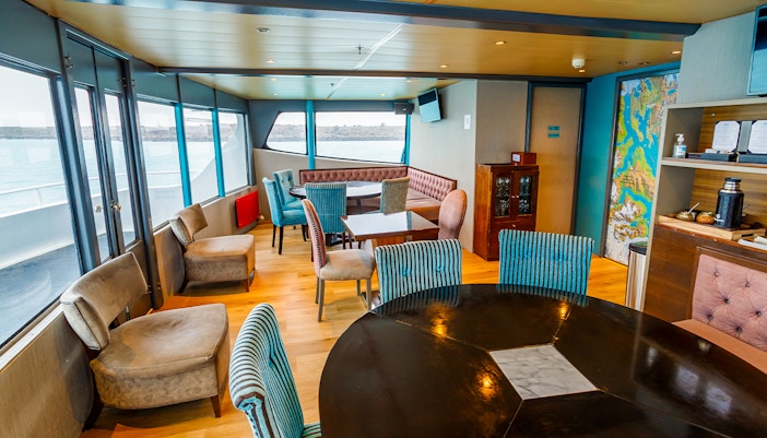 Premium boat interior with seating and lake view during Perito Moreno, Spegazzini & Upsala tour.