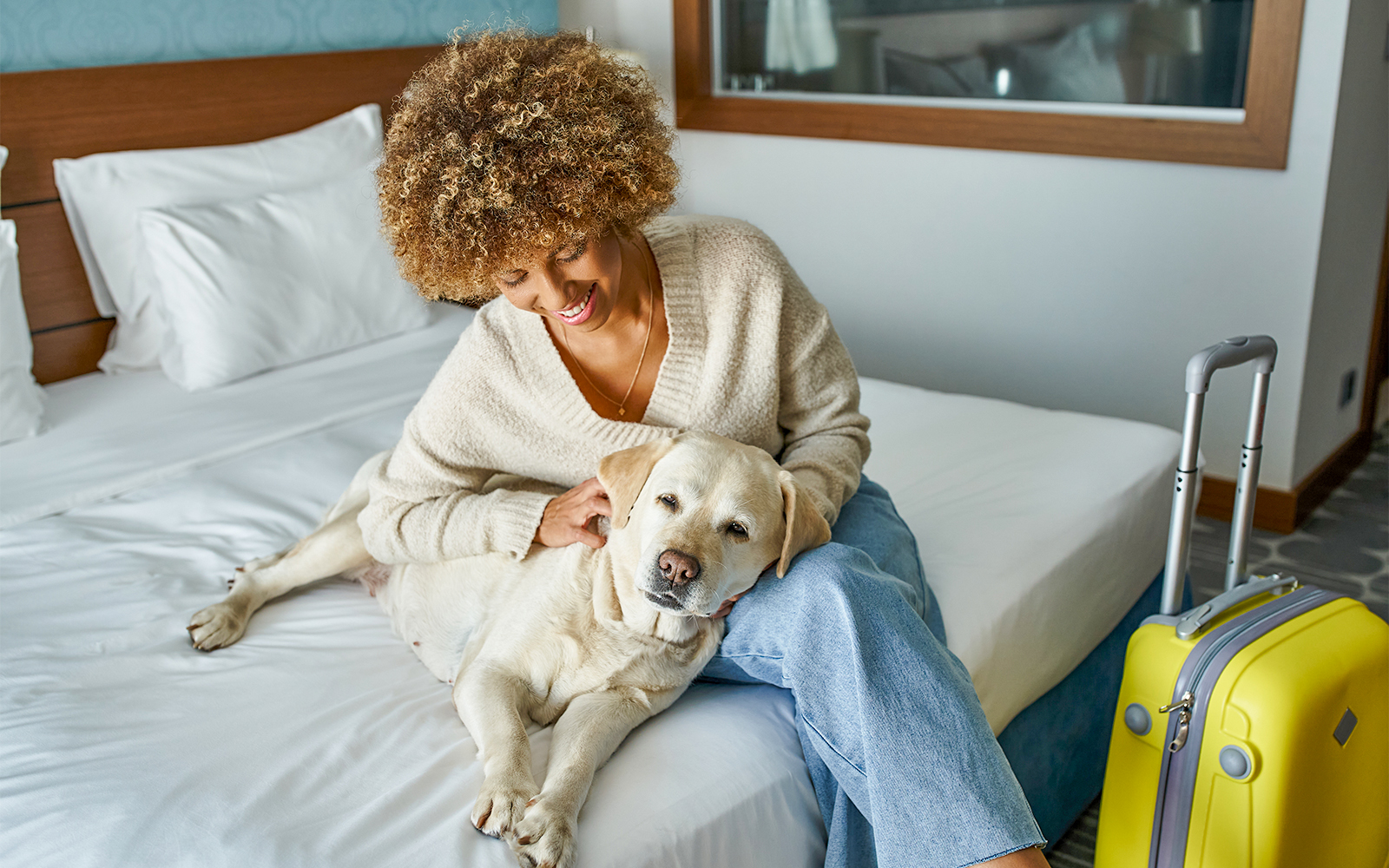Pet-friendly hotel room with a cozy bed and pet amenities in a welcoming setting.