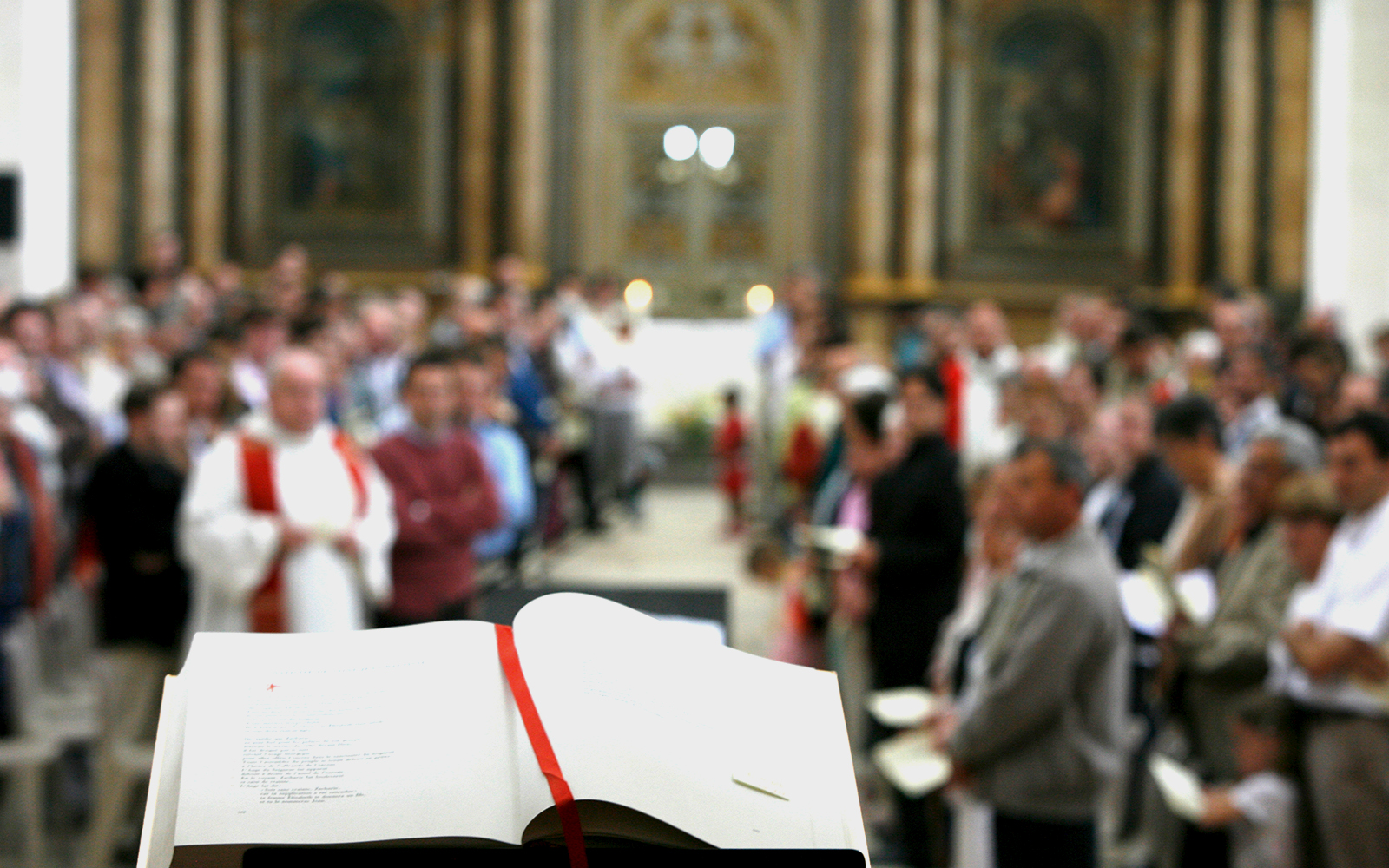 Chanting inside Notre Dame Cathedral, Paris, with intricate stained glass windows.
