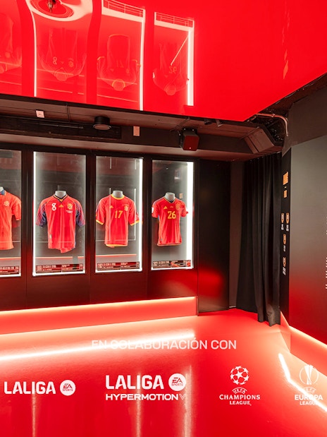 Football jerseys display at Legends of Football Museum, featuring La Liga and Champions League logos.