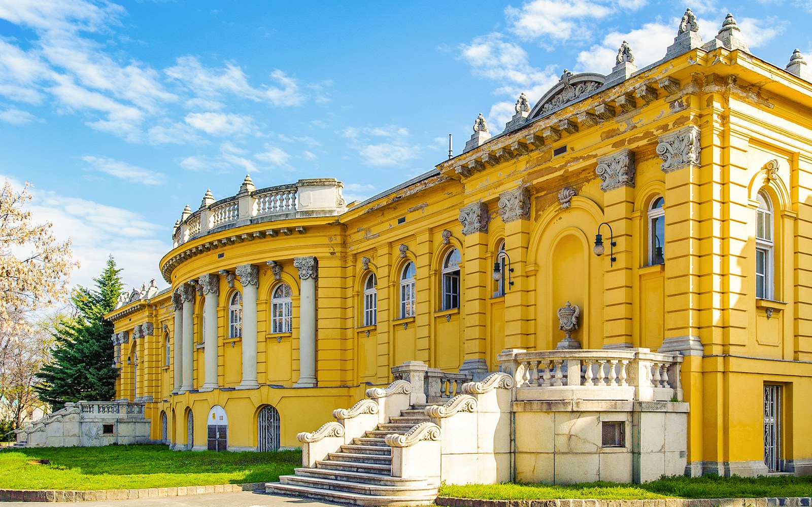 Szechenyi Medicinal Bath outdoor thermal pools in Budapest with people relaxing.