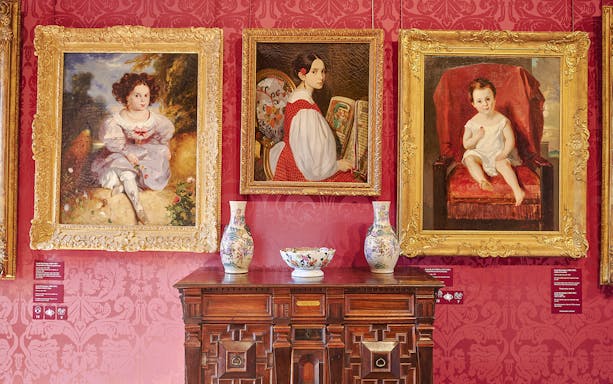 Paintings and ornate vases in the Victor Hugo House interior, Paris.