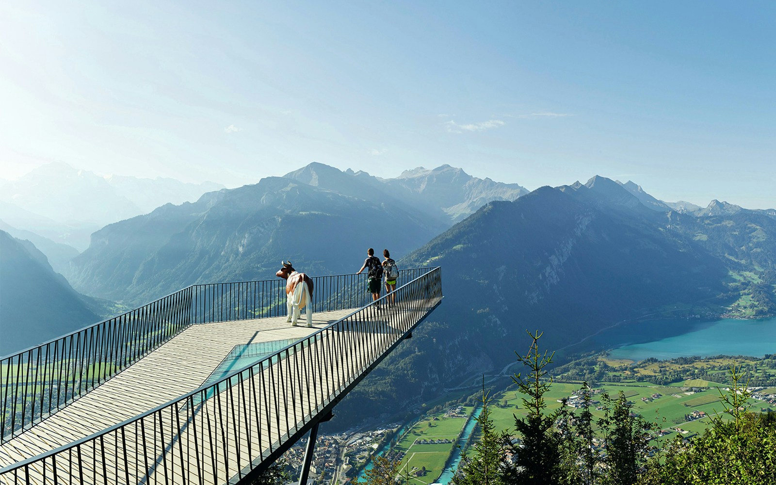 Couple enjoying mountain view at Two Lakes Bridge viewpoint.