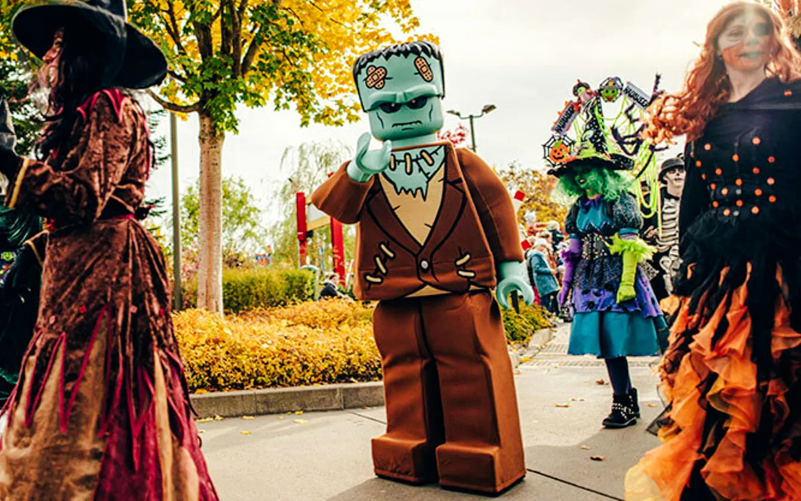 Lego Frankenstein and costumed visitors at Halloween event in Legoland Billund.