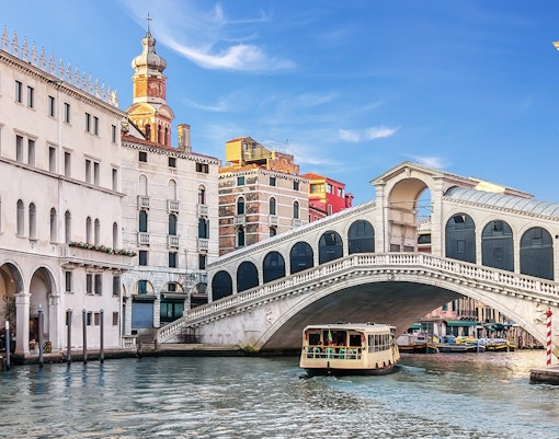 Water bus on Grand Canal near Rialto Bridge, Venice, Italy.