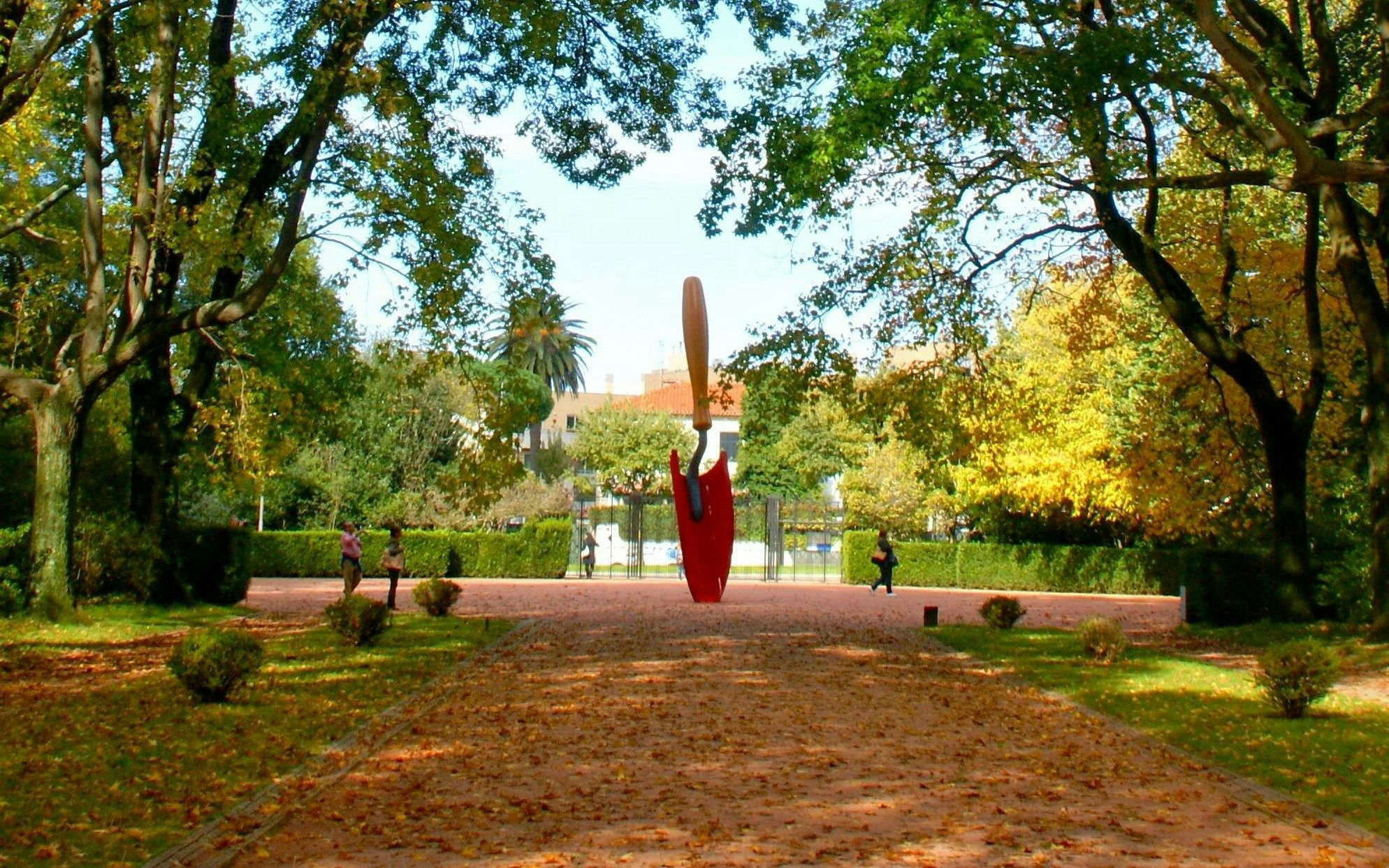 Sculpture in Serralves Park, Oporto, Portugal, surrounded by trees and visitors.