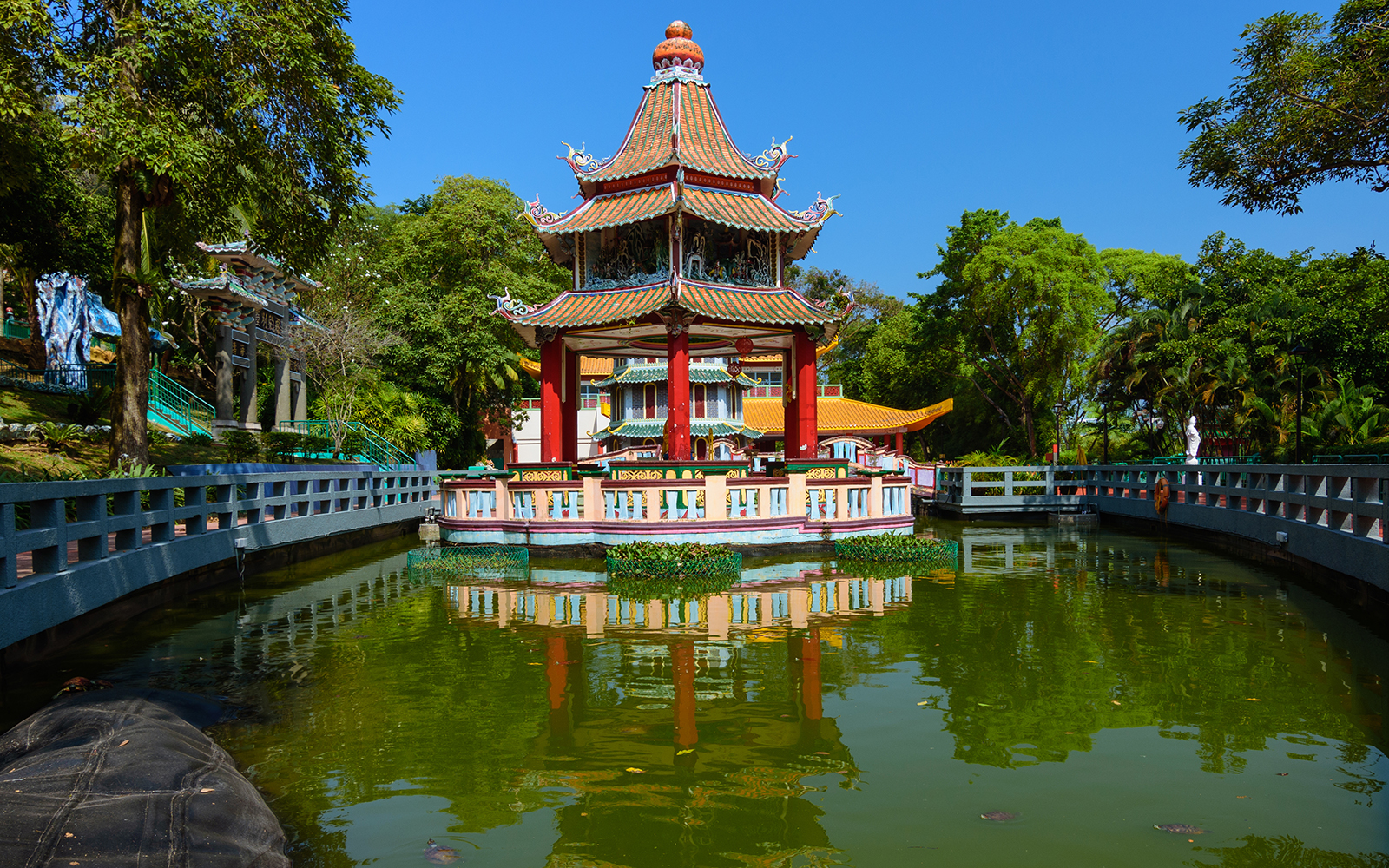 Haw Par Villa entrance with colorful statues and intricate Chinese architecture in Singapore.