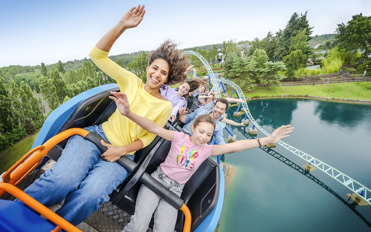 Visitors enjoying a roller coaster ride at Parc Asterix, France.