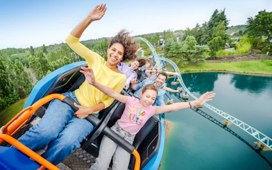 Visitors enjoying a roller coaster ride at Parc Asterix, France.